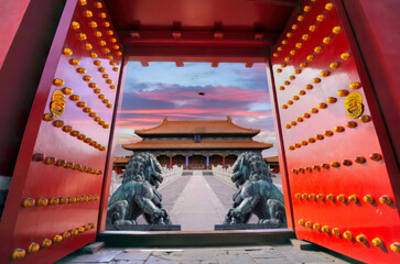 Traditional Chinese Gate and Lions at Forbidden City, Beijing at Dusk