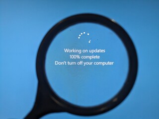 Magnifier on the blue screen of. the computer screen, Windows update message