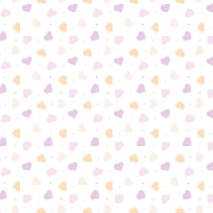 Seamless pattern of pink and peach hearts spread on a white background