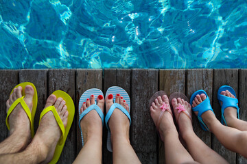 Family wearing brightly colored flip-flops