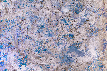 Aged old gray and white with blue strokes cement wall with uneven background, textured. Rough background. Copy space
