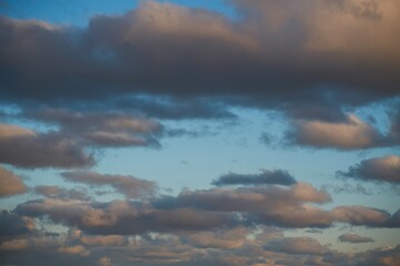 Natural sky background. A Symphony of Sunset Colors Painting the Evening Sky with Hues of Orange and Pink