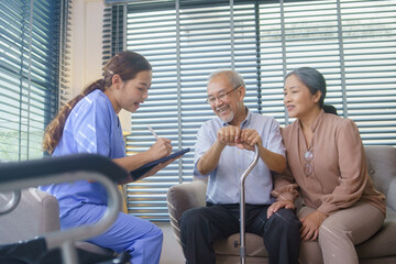 Asian nurse or caregiver visit senior man patient to diagnosis and check up health at home....