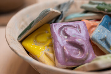 multi-colored clay samples of color in a plate, for painting dishes 