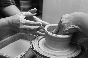 Black and white photo, clay, ceramics or hands in a design workshop working on an artistic cup or mug in a small business studio. Makes crafts in sculpture