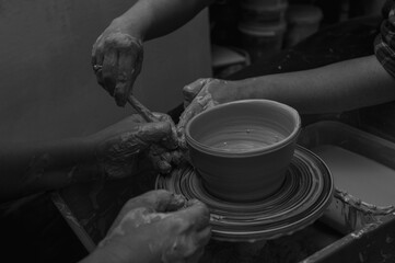 Black and white photo, clay, ceramics or hands in a design workshop working on an artistic cup or mug in a small business studio. Makes crafts in sculpture