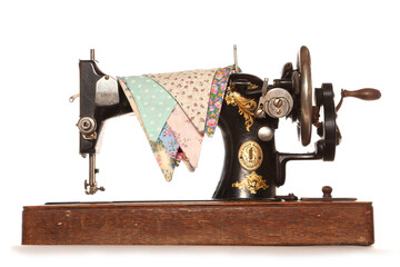 Singer sewing machine with bunting isolated on a white background