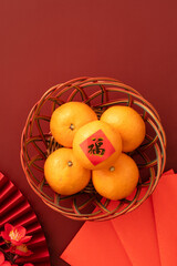 Chinese lunar new year background with fresh tangerine and the word means fortune.
