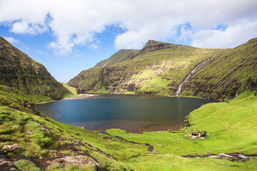 Nordic natural landscape, Saksun, Stremnoy island, Faroe Islands, Denmark. Iconic green roof houses.