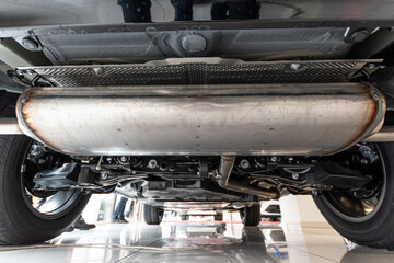 Closeup photo of car suspension and exhaust system