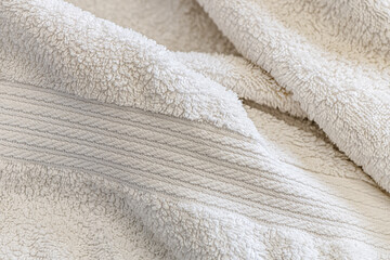 Fototapeta na wymiar abstract background of white terry towel nice wide border texture close up shallow depth of field