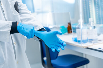 Doctor using latex gloves in the laboratory of an hospital