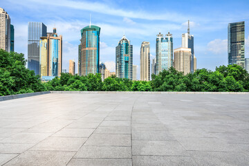 Fototapeta na wymiar Empty square floor and modern commercial buildings in Shanghai