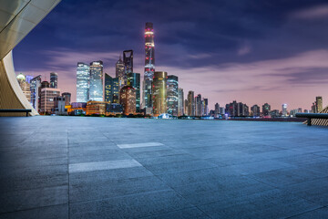 Empty floor and modern city building scenery at night in Shanghai