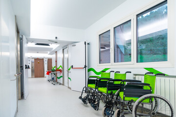 Corridor of an hospital with wheelchairs ready for patients