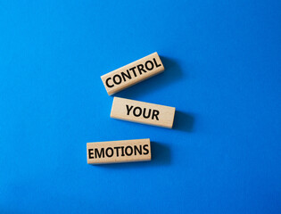 Control Your Emotions symbol. Concept word Control Your Emotions on wooden blocks. Beautiful blue background. Psychology concept. Copy space