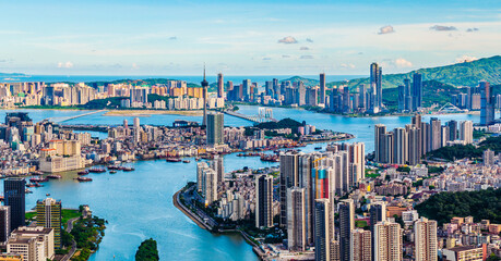 Aerial view of Zhuhai and Macau city skyline with modern buildings landscape at sunset. Famous travel destination.