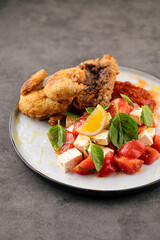 Cooked gherkin chicken with vegetable salad