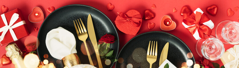 Beautiful romantic table setting on red background top view