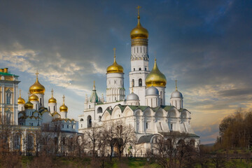 Fototapeta na wymiar Majestic Russian Orthodox Cathedral with Gilded Domes under Dramatic Sky, Moscow, Russia
