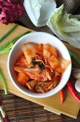 Top view of Korean Kimchi Bowl with Ingredients on Background