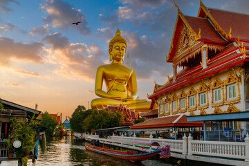 Golden Hour at Thai Temple with Colossal Buddha Statue, Traditional Long-Tail Boat, and Serene...