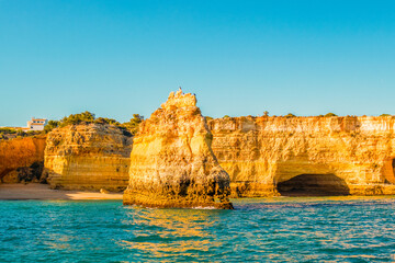 Fototapeta na wymiar Beautiful limestone Algarve coast with caves and rock formation, south of Portugal