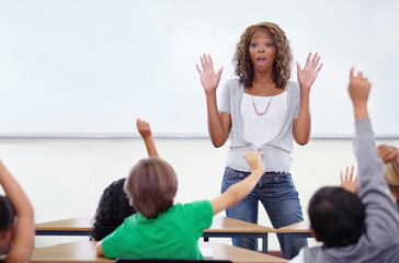 Black woman, teacher and children with question in classroom for education, learning or answer. African female person, lecturer or educator with kids and hands raised for interaction in presentation