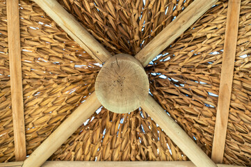 Underneath of a beach wooden hut's roof