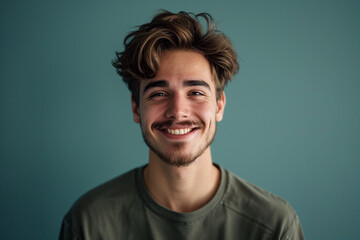 Fototapeta premium Fashion young man in studio giving pose on isolated color background