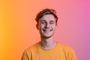 Fototapeta premium Fashion young man in studio giving pose on isolated color background