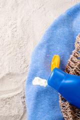 Dirty stain of spilled cream on clothes on the beach. White skin care product. Daily life dirty stain concept. top view.