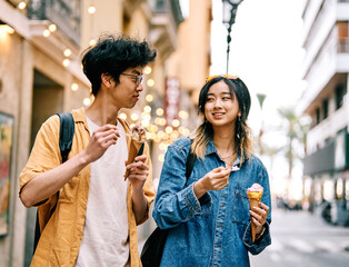city young woman travel tourist outdoor couple happy vacation lifestyle holiday street summer urban tourism traveler town journey trip ice cream dessert food