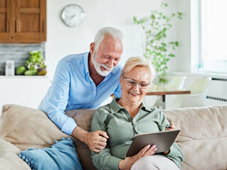 woman couple senior man happy internet love tablet together mature active elderly retirement...
