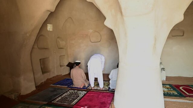 Peoples worshiping Inside Oldest Mosque in United Arab Emirates