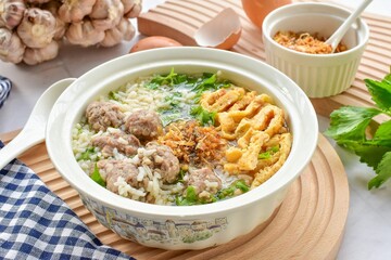 Rice soup with minced pork and omelet, thai food ,asian food, top view food table