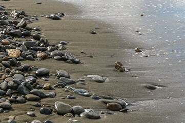Fototapeta na wymiar sand and stones on the Mediterranean beach in winter 4