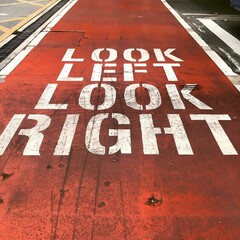 Sidewalk sign displaying the words "Look Right Look Left". Sydney, Australia