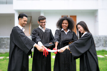 Group of friends congratulate each other when they graduate.