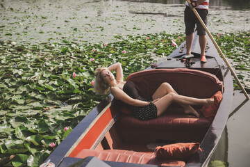 Concept of peaceful and relax. European lady in gondola resting - obrazy, fototapety, plakaty