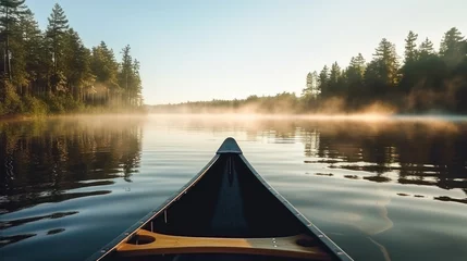 Foto op Plexiglas Mistige ochtendstond Bow of a canoe in the morning on a misty lake in Ontario, Canada.