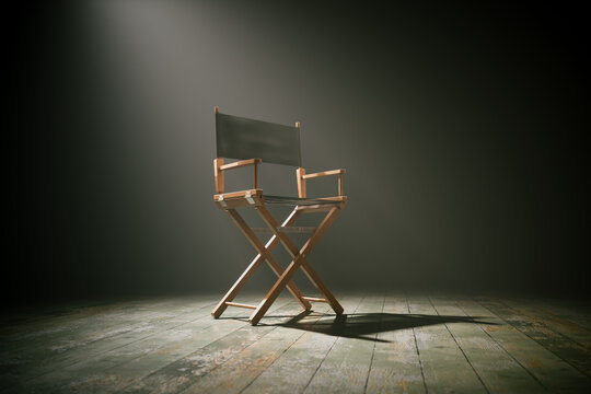 Solitary Director's Chair Under Spotlight on Vintage Theater Stage