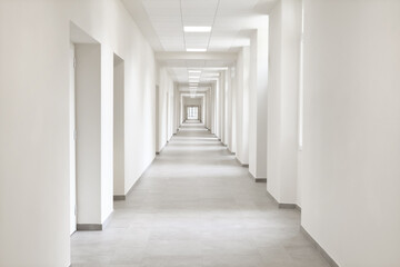 empty hallway, very long corridor with many doors for rooms of hospital, hotel, school or laboratory, building with many office, campus for medical and scientific experiments, research, or teaching