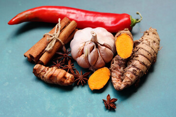Immune system booster ingredients top view photo.  Spices and herbs on a blue background with space...