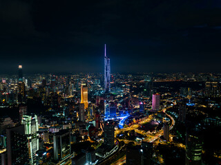 An high angle aerial view of the tallest Skyscrapper in south east asia during night with colorful...