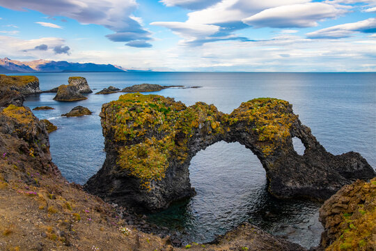 Gatklettur "Hellnar Arch" is a famous, naturally formed stone arch found between the villages of Arnarstapi and Hellnar on the Sn&aelig;fellsnes Peninsula in Iceland. Tourist attraction and sight.