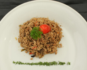 Spicy Shredded Tuna Fish is an Indonesia food. It is from smoked fish, chillies, spices and herbs. Selective focus.
