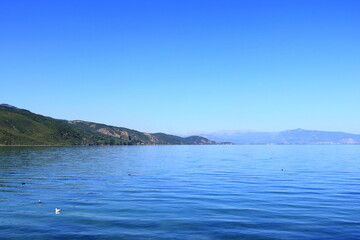 Fototapeta na wymiar Beautiful lakeshore landscape at lake ohrid (near Lin village), Albania