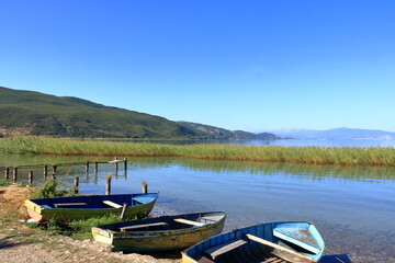 Naklejka na ściany i meble view of Lake Ohrid with fisherman boats near Lin, Albania