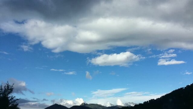 windy clouds on blue sky timelapse